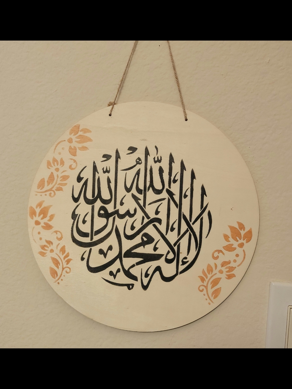 Handpainted Round Wall Plaque with Black Calligraphy and Peach Accents